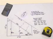 The author draws a full-scale triangle to match the rise and run of the stair he's building.