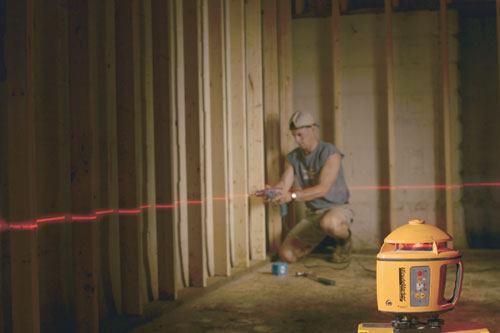 Going straight: Laser level lines take the guesswork out of where to drill for wire, pipe, and tubing--all of which go in easier through a straight run of holes.