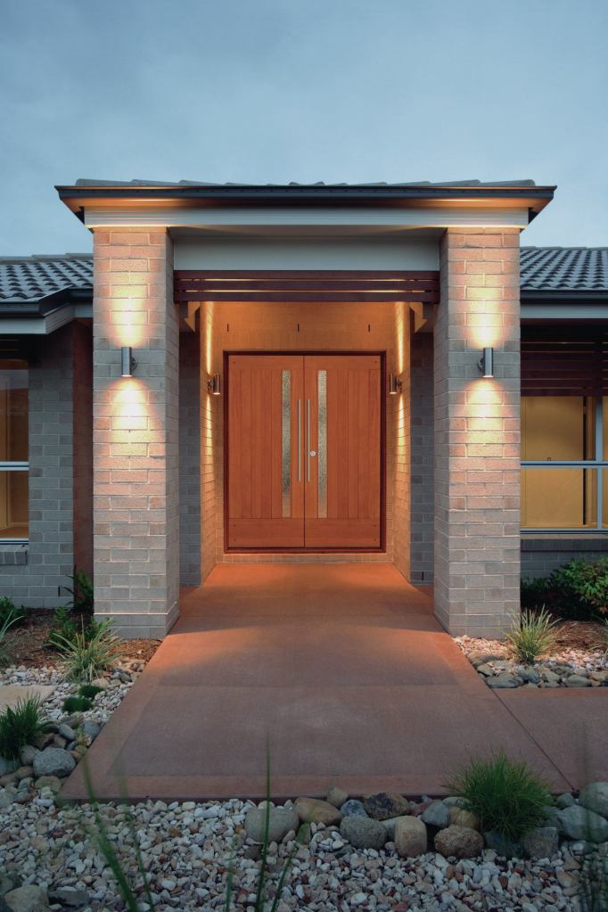 A new home with attractive outdoor lighting.