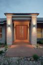 A new home with attractive outdoor lighting.