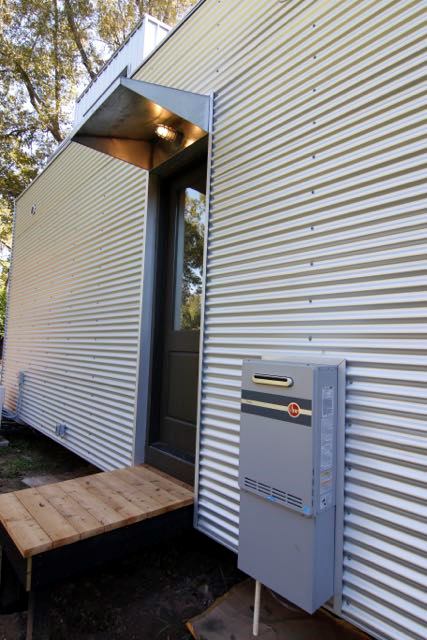 Rheem Tankless installed near the back door of this house.