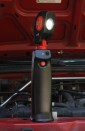 The work light will stand in the upright position or can be attached (from the bottom ) to a tripod or anything else with a 1/4 x 20 thread.