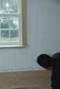 A laser indicated how the edge of the window trim would line up with the grooves on the wainscot.