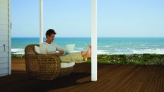 Man using laptop computer outdoors