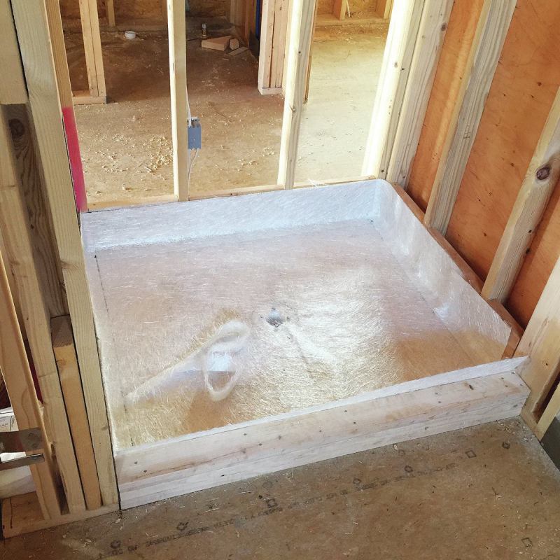 Fiberglass can be an effective shower pan material. Fiberglass cloth is fitted in the pan area, then is impregnated with resin to form a waterproof pan.