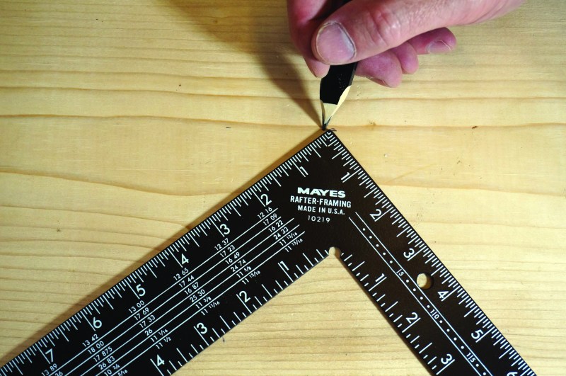 After setting rise and run stair gauges, place a square against the board and mark the heel.
