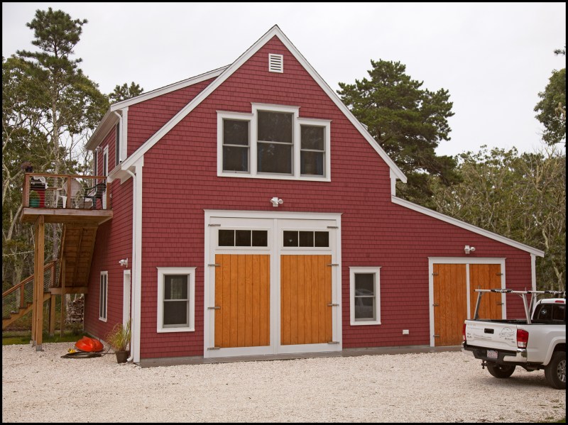 After completing interior finish work for the living quarters above a ground-level boat-building workshop, the author was asked by to build two sets of barn doors (one pair for an 8-foot-square opening and another for a larger, 12-foot-square opening). The larger doors would allow his client to move small boats he planned to build in and out of his new shop.