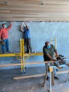 Workers for Risinger & Co. keep their distance when possible, and wear masks on the job, as distancing is not always practical.