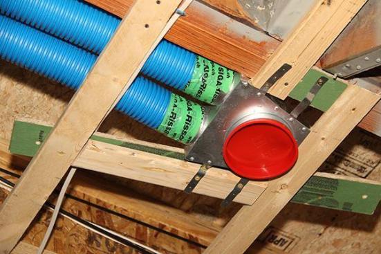 An air supply register in the ceiling. Each register can be served by either one or two three-inch lines, depending on the quantity of air needed. The system is fine-tuned by adjusting manifolds and fan speeds, and can be modulated as needed in service to respond to changes in the required exhaust and supply rates. The Air Pohoda system also offers active humidity control for the building.