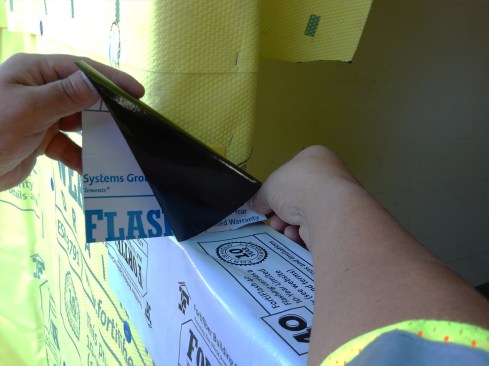 Step 3 (cont.). Apply Sill Pan Flashing. Install SAF sill-pan end-dam flashing at the sill’s three-directional corner, covering vertical leg of plastic flashing corner and lapping it a minimum 1 inch on to the sill. Slit patch in order to fold on to face of sheathing.