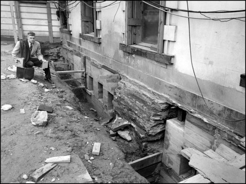 National Park Service photographer Abbie Rowe (shown here) photographs progress completing the underpinning east of South Portico of the White House. Work crews would pour 126 new concrete piers to support the building’s historic masonry façade. The underpinning was completed by the end of June 1950.