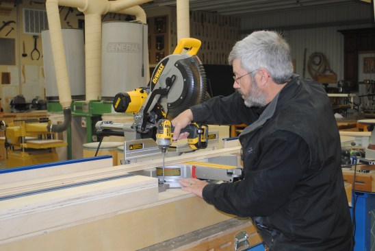 Extra space can be left to help with cutting crooked boards. Drive screws through each saw foot to hold it in place.