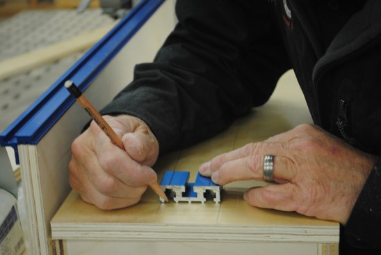 Using a small section of track, mark out the bolt positions