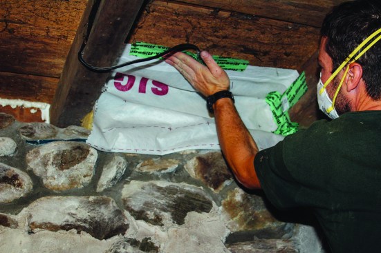 Next, the membrane was folded up and tailored to fit around framing andmechanicals.