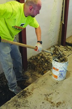 When all the beams were set and the concrete cured, the crew removed the rest of the slab between the wall and the line they
scored earlier with a saw.
