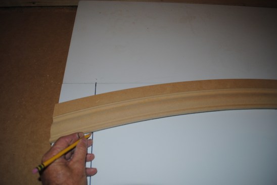 When installing an eyebrow arch with a finished floor below, it's easier to do the layout on a table so you can cut the length of the sides to fit at the end. First trace the arch onto the table or bench.