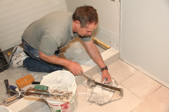 A score-and-snap tile cutter works well for cutting many large-formatglass tiles.