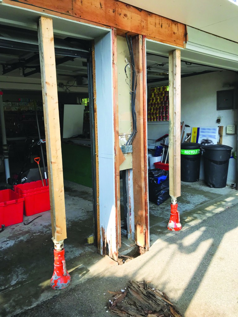 Before doing any more work on the support, the author propped up the continuous 6x12 header spanning the openings with a pair of house jacks.
