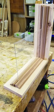 The simplest glass option captures a glass panel between two strips of panel molding.