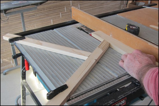 Clamped to the table, this feather-board combo maintains constant pressure against the fence for safer and more accurate cuts. Feed-through past the blade is completed with the push stick.