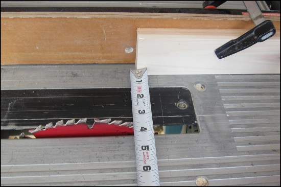 Here, an offset block attached to the fence ensures the waste can fall free beyond the cut. The cut is measured between blade and block.