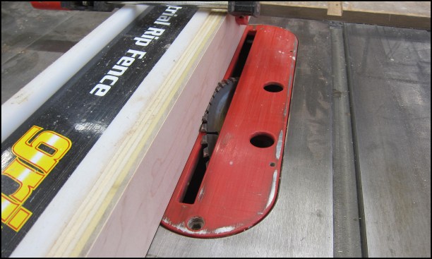Uniform edge beveling can be performed by embedding the angled blade into the face of a sacrificial fence to the left of the blade, no feather board needed. Use a test piece to adjust the exposure