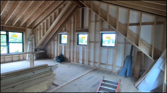 The home’s thermal shell (2-inch EPS with taped seams sandwiched between the sheathing and 2x6 studs) was airtight, though some small leaks were discovered at the shed dormer framing and sealed before the wall assembly was completed.