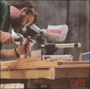 Figure 3: The author completes the newel pocket notches with a sharp chisel.
