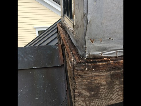 The upper portion’s WRB drained onto the exposed, stepped-out base framing, turning this handsome architectural feature into a conduit for water. Also, cracks along a site-applied 5/4-square sill trim appeared to be the likely water entry points. See detail 1.