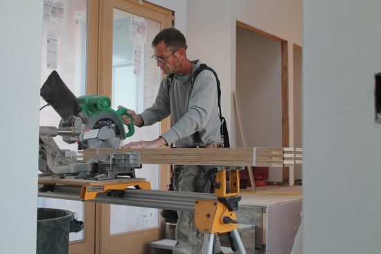 Cutting the panels to length is easy. Just set a whole bundle on the chop saw and cut six pieces at once to the proper length.