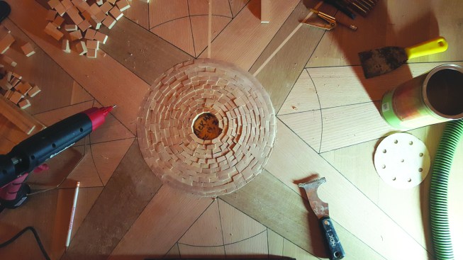 The center is a spiral of end-grain maple with a walnut burl center.