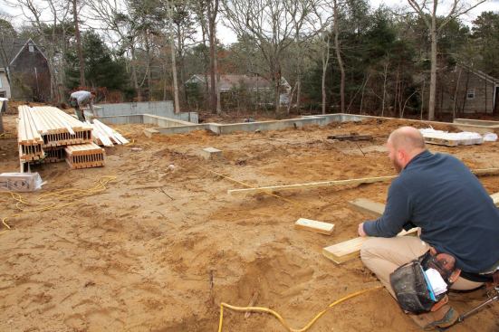 We had already marked the front left corner (at the opposite end of the house from the garage), so we marked the same measurement at the back just before the foundation began to step down.