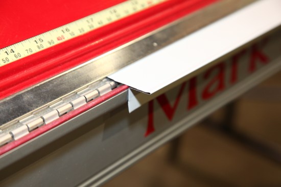 “Hem” is the term used to describe material that’s bent back on itself to make a finished edge. Hems are often part of another shape, such as this drip edge.