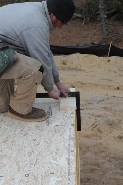 Repeat the process marking the opposite corner of the baseline wall and then snap a chalk line between the corners for the baseline.