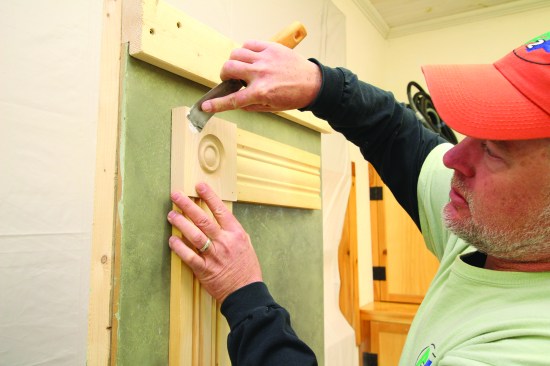 The author uses a flexible putty knife to fill the fastener holes with light- to medium-bodied filler.