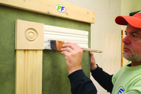 Then he brushes the bottom edge and the face.