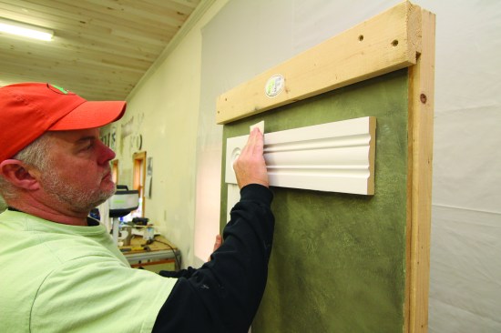 Applying primer raises the grain on a wood surface, so light sanding is always required before finish coats. The author scuffs over every surface with finegrit sand paper, taking care not to break through the paintedsurface.