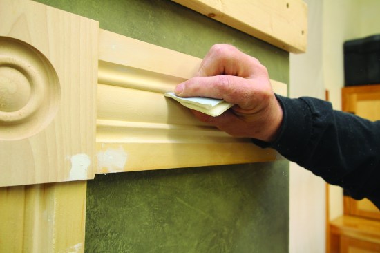 Folding sandpaper to a sharp crease can be effective for smoothingout the narrow grooves of a trim profile.