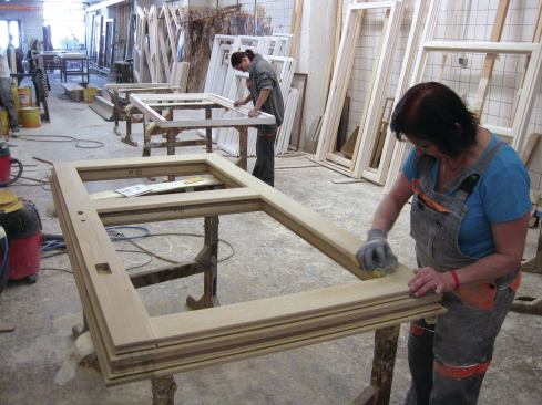 After the frames are assembed, each one is sanded by hand to remove slight imperfections.