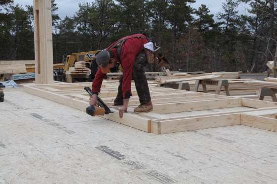 The last framing to be installed before the sheathing is the second top plate. Note that it is held back the width of a 2x6 to tie into the top plate of the adjacent wall.