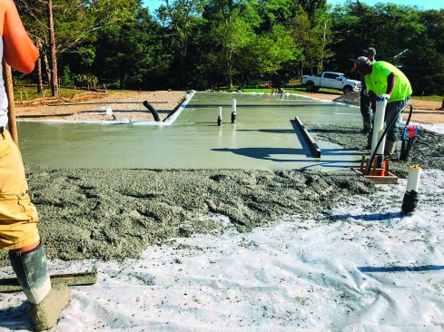 The slab was placed in the usual fashion over the poly with extra care to keep it absolutely flat.
