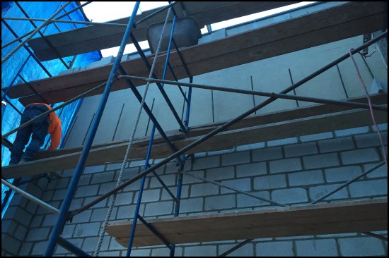 The addition’s two-story walls were built with 8-inch block and reinforced with continuous #5 rebar (running from footing to top of wall) embedded in the footings 2-feet on center. The block cores were infilled at all vertical rebar locations with mortar. Two bond beams (coordinated with our ledgers placed at floor levels) were also filled solid.