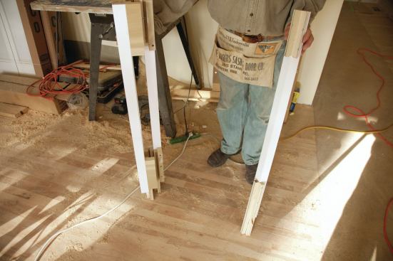 The main stair newels were site-built from 1 3/4-inch-square pre-primed poplar balusters.
