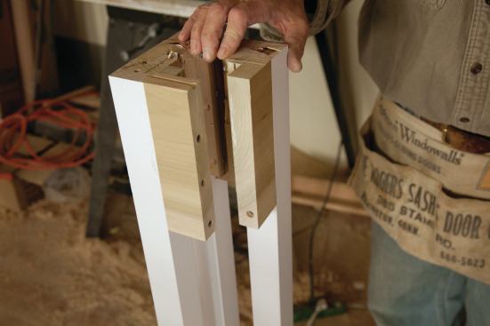 The balusters are connected together top and bottom with solid 5/4 poplar infills and 3/4-inch cleats. 