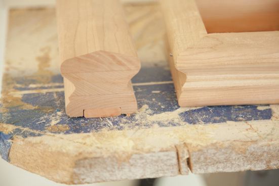 The newel post caps were made on site from cherry handrail stock ripped in half lengthwise and mitered together. 