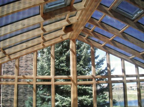 A roof with a ridge beam can be more easily understood if it's imagined to be a flat surface—like a deck in plan view. The ridge is constructed as a beam that runs from end to end. The ends of the beam must be supported as concentrated loads, generally by posts inside walls or in the middle of a room. The rafters are then connected to the beam and transmit their full vertical load downward. Again, picture deck joists connected to a beam with hangers. The other ends of the rafters bear on the exterior walls.