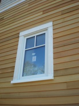 Placing a window in the outer third of a thick wall puts the window in the colder part of the opening and carries the risk of creating a cold microclimate in the window pocket on the interior.