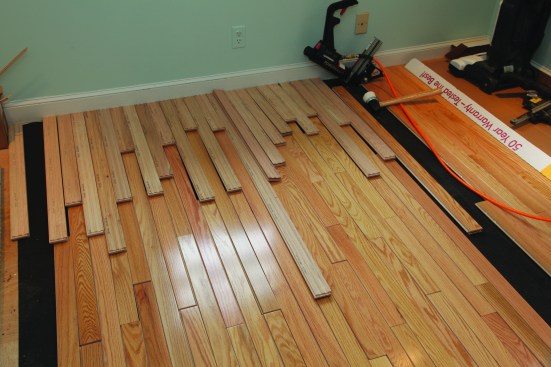 At the end of the floor, the person racking lays down the final pieces upside down and backward.