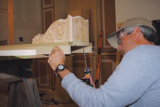 U-shaped pilasters are glued and pocket screwed together on site. Here a decorative corbel is screwed to the top of the pilaster.