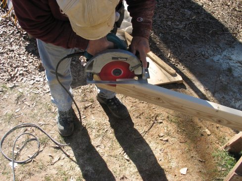 To cut the acute angle, make the cut from both sides of the plate stock. When finished cutting, smooth the cut  surface wth a belt sander. Measure and cut the plate to length by making a simple plumb cut at the top.